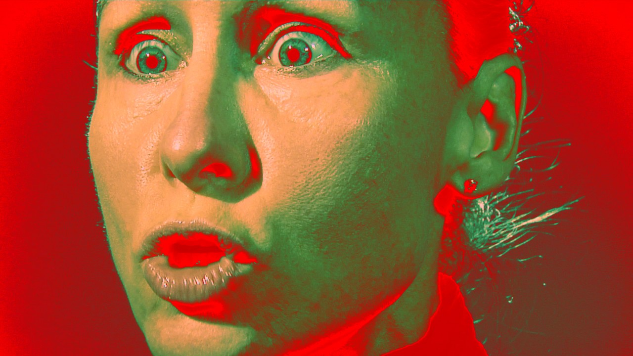 Image of man's face in only red and green