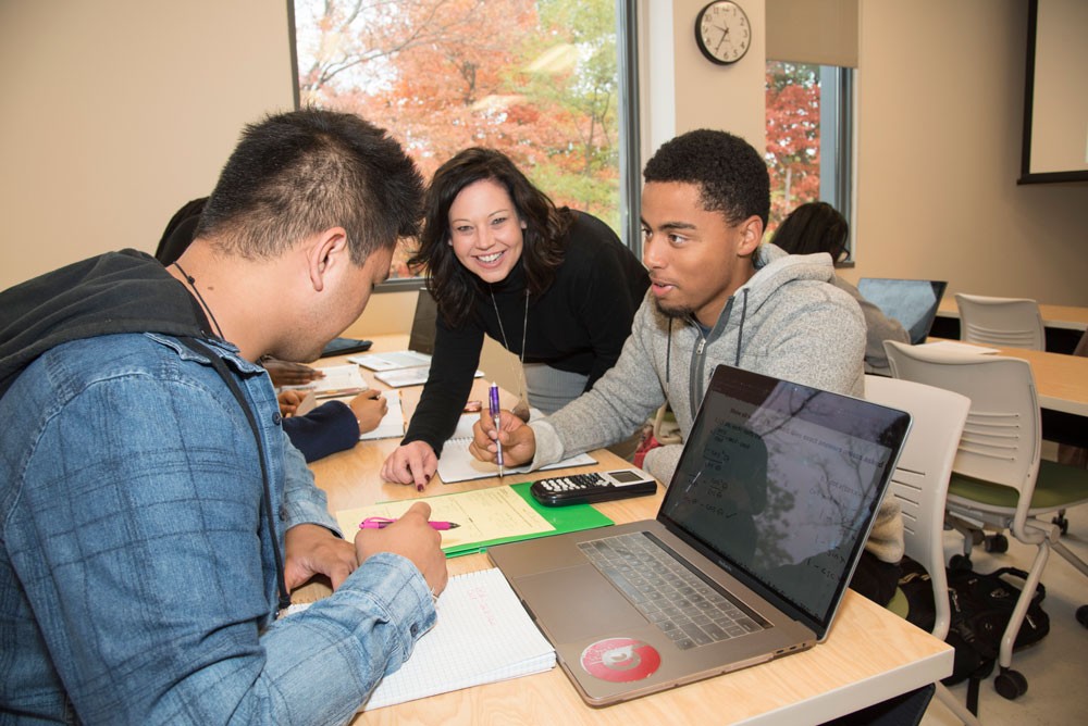Student receiving one-on-one instruction from professor