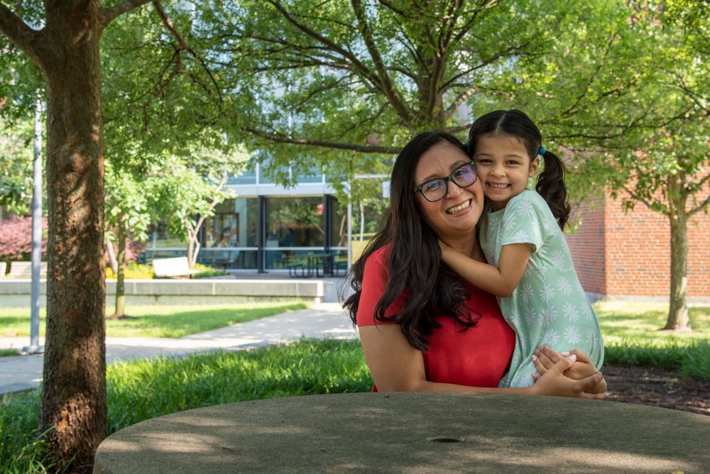 Edlin Maldonado-Fuller with her daughter Cecilia on the UC Blue Ash campus.