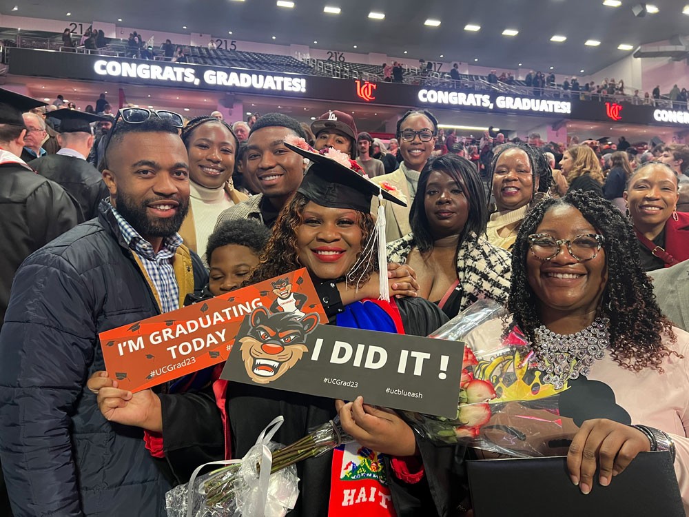 Nadege and her family after the 2023 Fall Commencement Ceremony