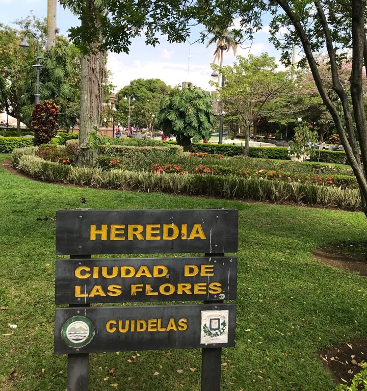 City of Flowers sign in Costa Rican garden