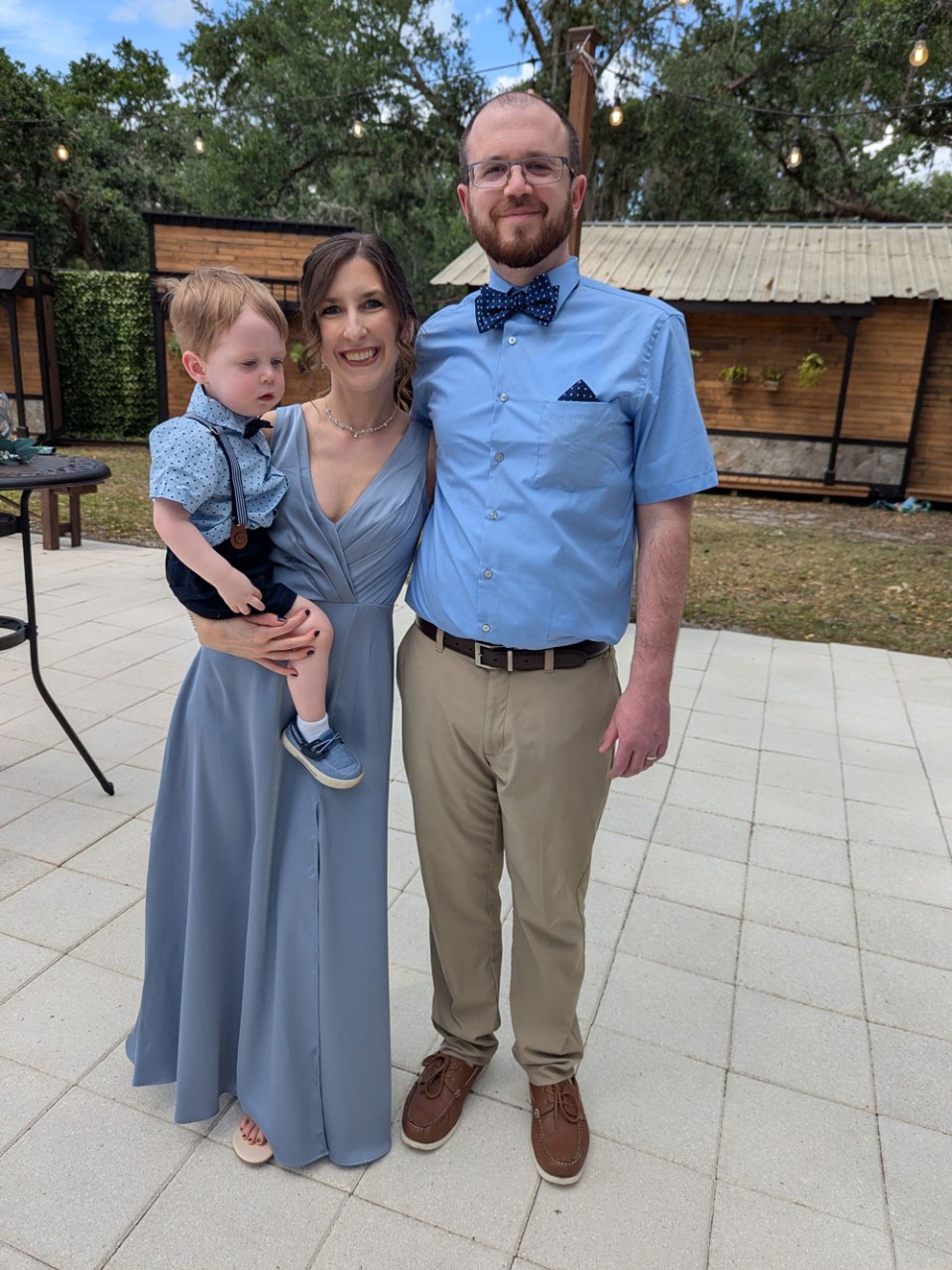 family of three people outside