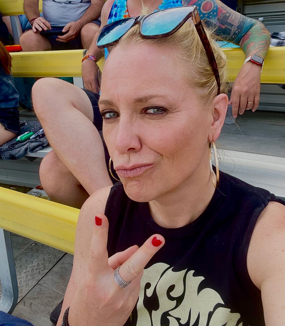 smirking woman at concert